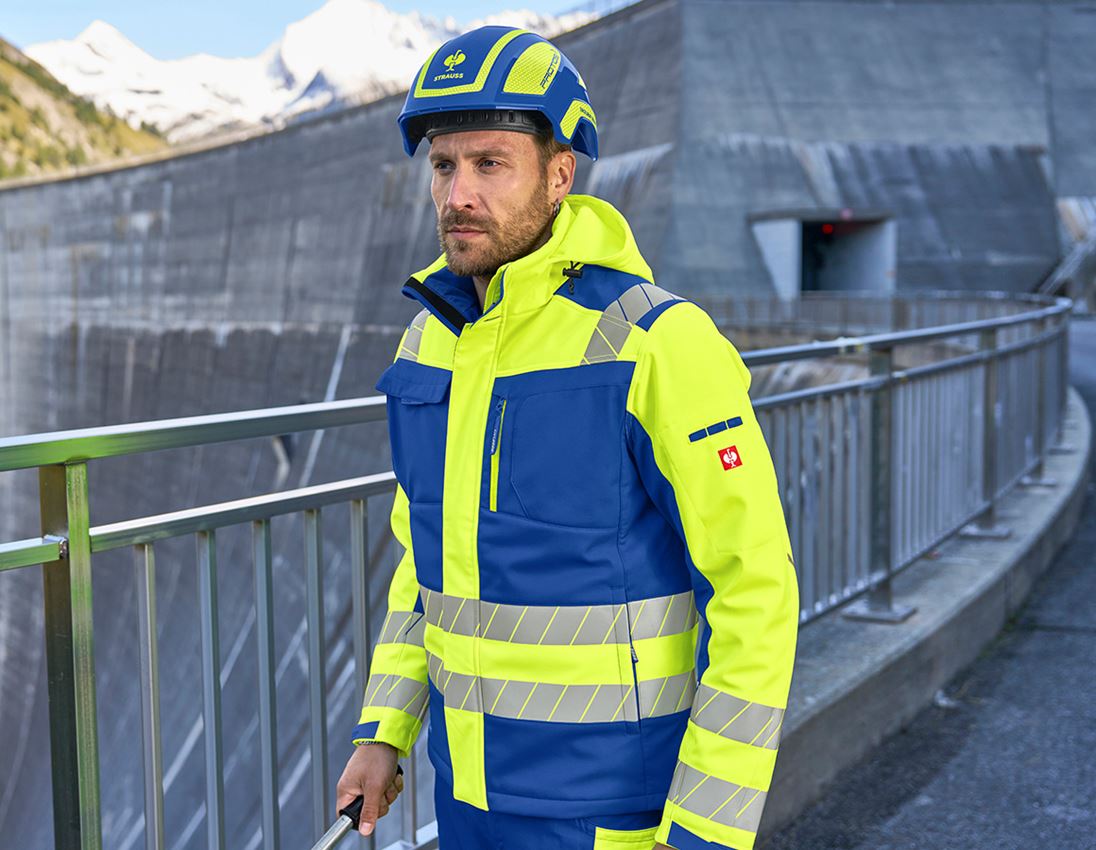 Pracovní bundy: Výstražná zimní softshellová bunda e.s.motion 24/7 + modrá chrpa/výstražná žlutá